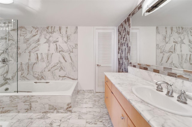 bathroom featuring tile walls, vanity, and independent shower and bath