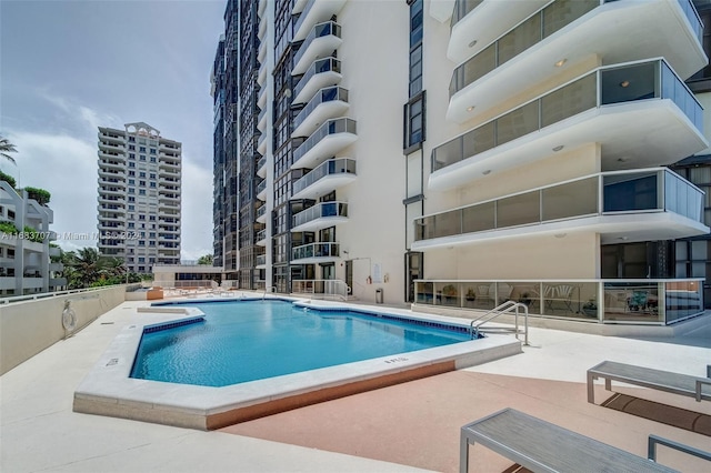 view of swimming pool with a patio area