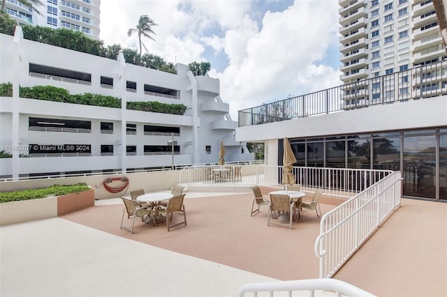 view of patio featuring a balcony