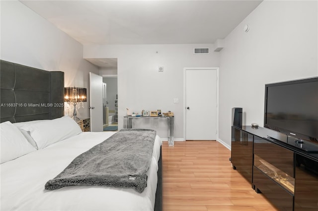 bedroom with light hardwood / wood-style floors