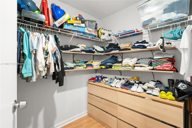 spacious closet with light hardwood / wood-style floors