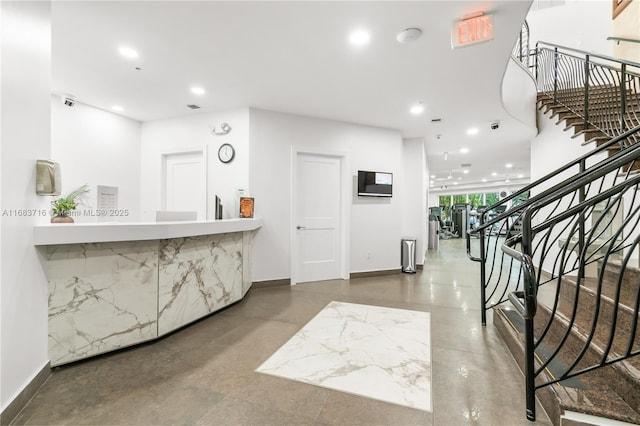 reception area with visible vents and stairs