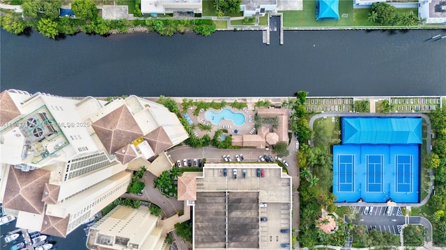 birds eye view of property with a water view