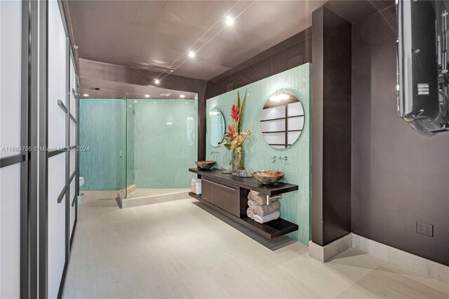 bathroom featuring vanity and a shower