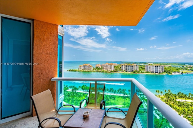 balcony featuring a water view