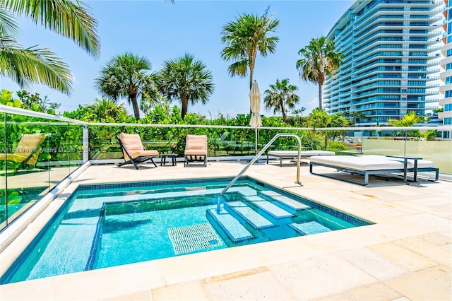 view of swimming pool featuring a patio area