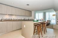 kitchen featuring a kitchen island and a kitchen bar