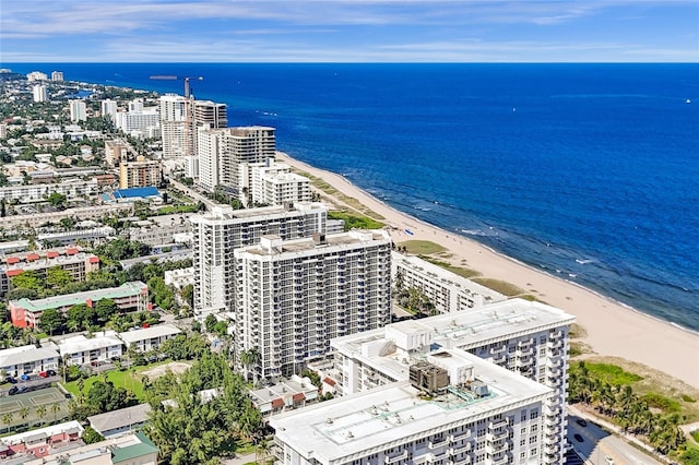 birds eye view of property with a view of the beach and a water view