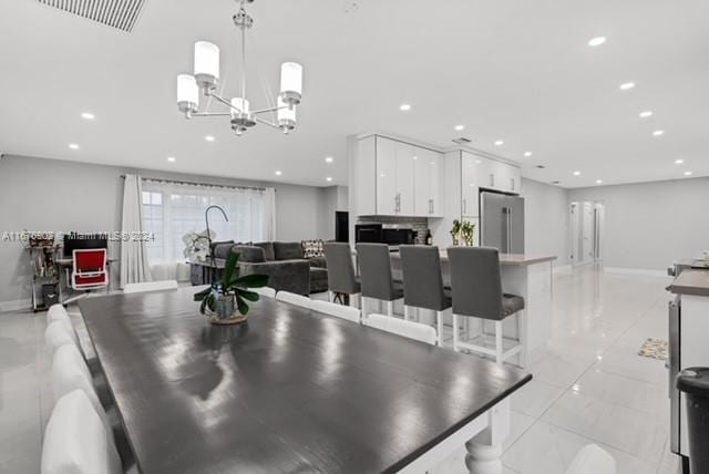 dining area featuring a notable chandelier