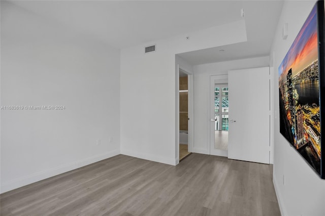 unfurnished room with light hardwood / wood-style floors