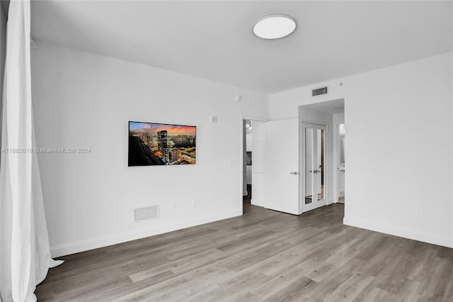 empty room featuring hardwood / wood-style floors