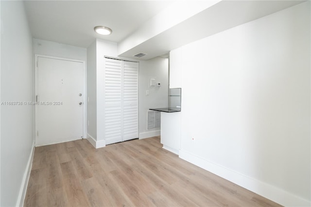 spare room featuring light hardwood / wood-style flooring