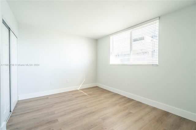 spare room featuring light hardwood / wood-style flooring