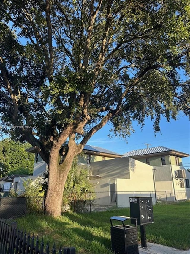 view of side of property with a mail area