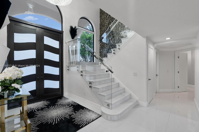 foyer featuring french doors and tile patterned floors