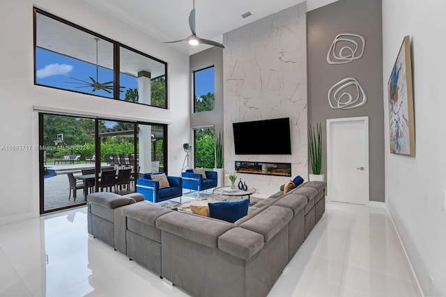 2440 SW 105th Ter, Davie, FL 33324 - living area featuring a ceiling fan, a towering ceiling, and tile patterned floors
