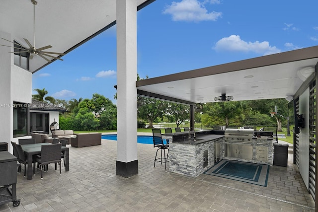 view of patio / terrace featuring an outdoor living space, area for grilling, a grill, and ceiling fan