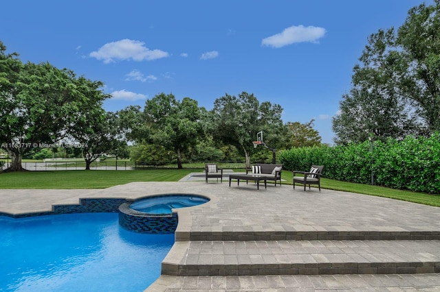 view of swimming pool with a patio area, an in ground hot tub, and a lawn