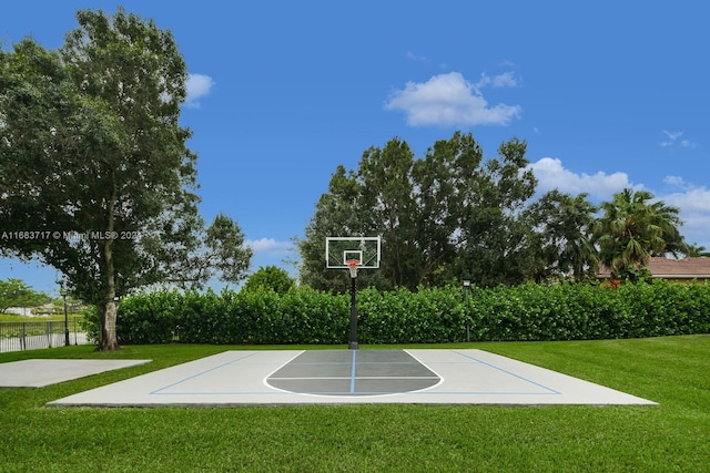 view of basketball court featuring a lawn