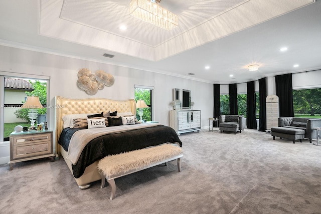 carpeted bedroom featuring crown molding, a raised ceiling, and multiple windows