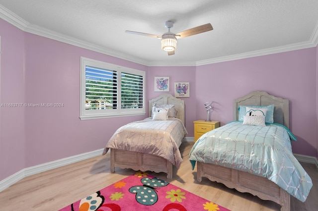 2440 SW 105th Ter, Davie, FL 33324 - bedroom with wood finished floors, crown molding, ceiling fan, and a textured ceiling