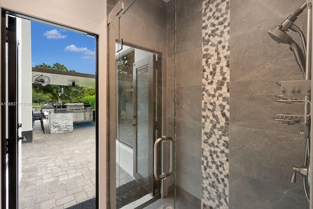 bathroom with a shower with shower door