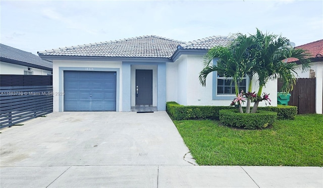 view of front facade with a garage, driveway, fence, and stucco siding