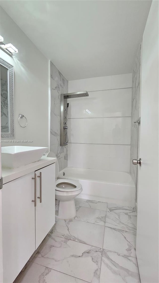 full bathroom with vanity, toilet, and tiled shower / bath combo