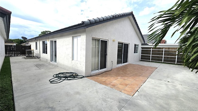 view of patio / terrace with fence and central AC