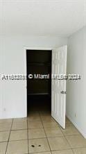 hall featuring tile patterned floors