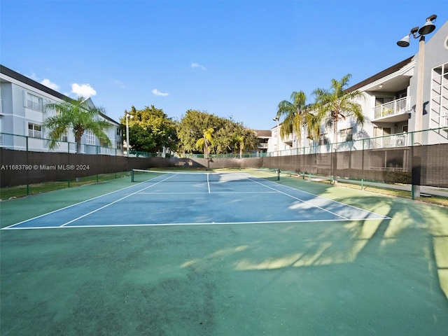 view of sport court with basketball hoop