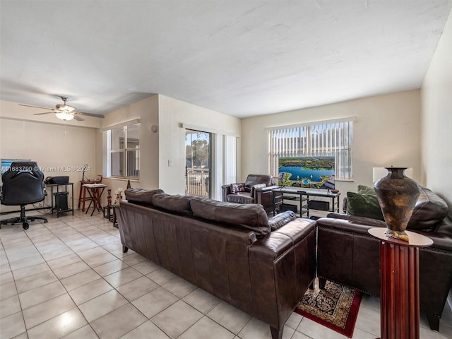 tiled living room with ceiling fan