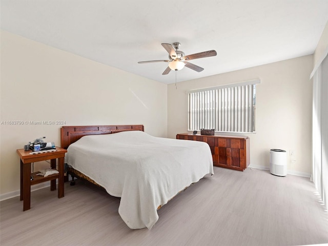 bedroom featuring ceiling fan and light hardwood / wood-style floors