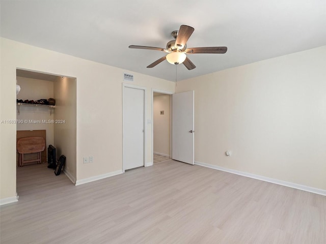 unfurnished bedroom featuring light hardwood / wood-style floors and ceiling fan