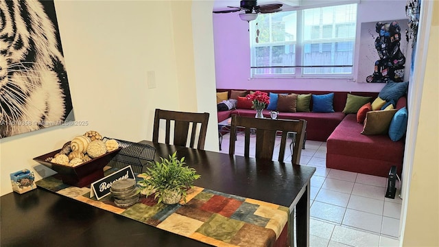 tiled dining room featuring ceiling fan