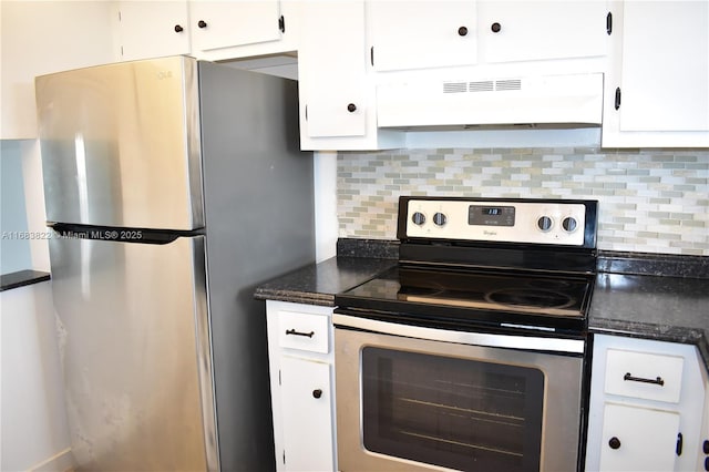 kitchen featuring appliances with stainless steel finishes, white cabinetry, dark stone counters, and tasteful backsplash