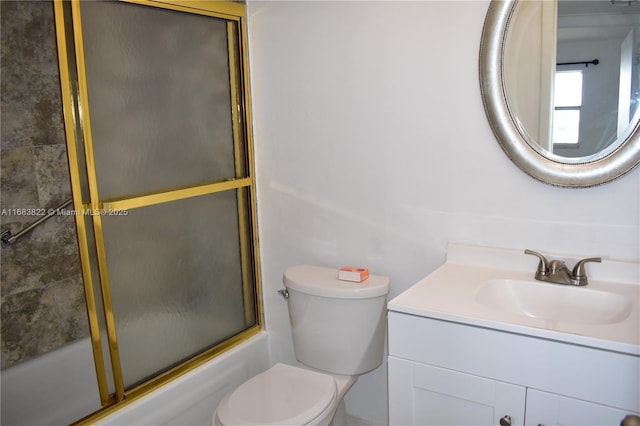 full bathroom with bath / shower combo with glass door, vanity, and toilet