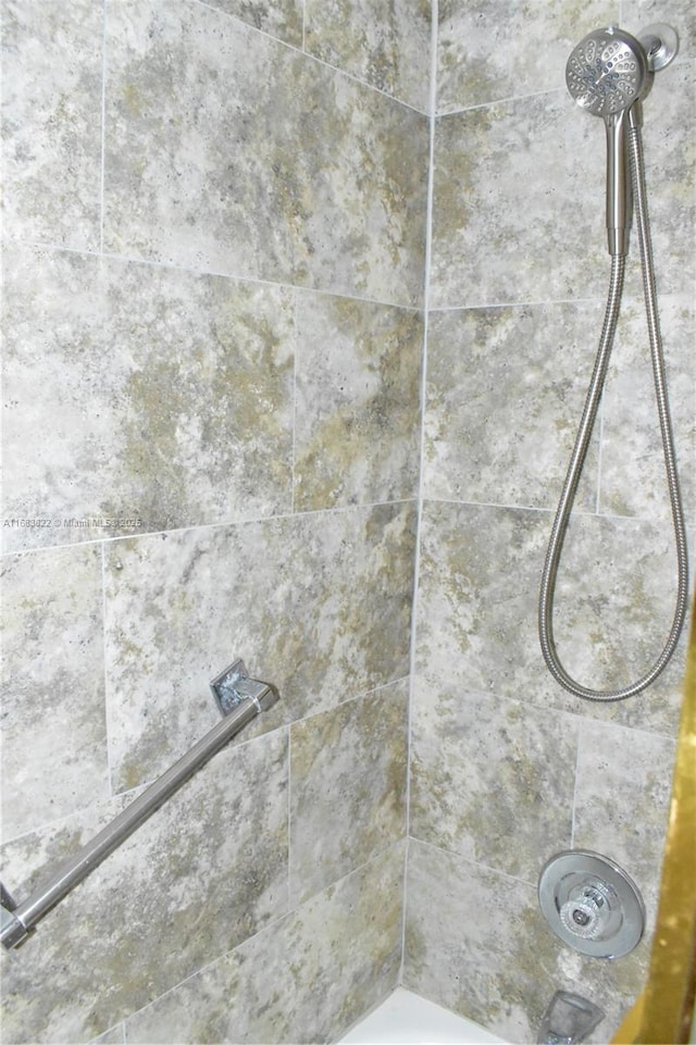 room details with a tile shower