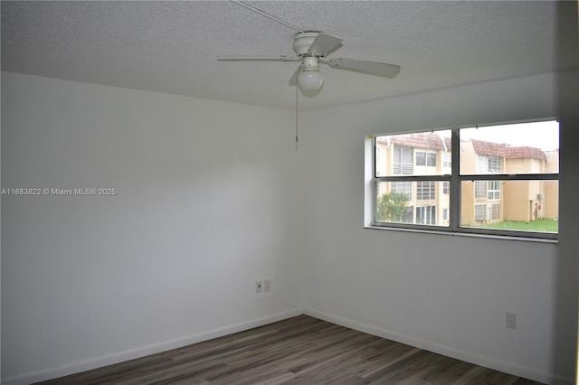 spare room featuring a textured ceiling, ceiling fan, and dark hardwood / wood-style flooring