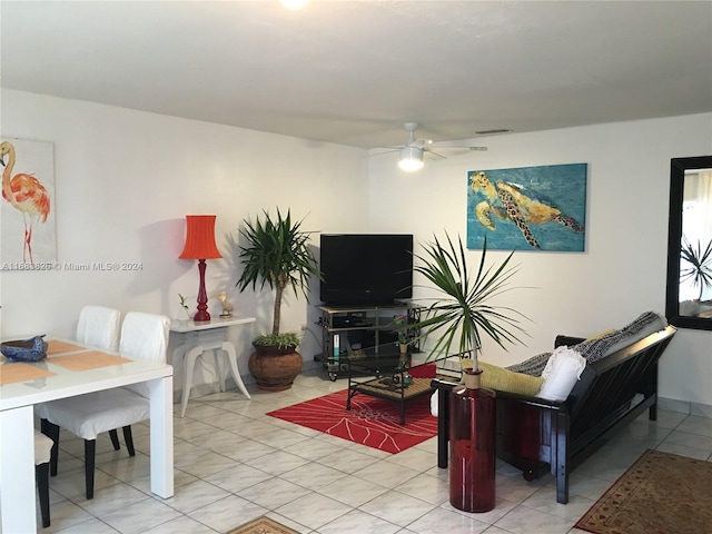 tiled living room featuring ceiling fan