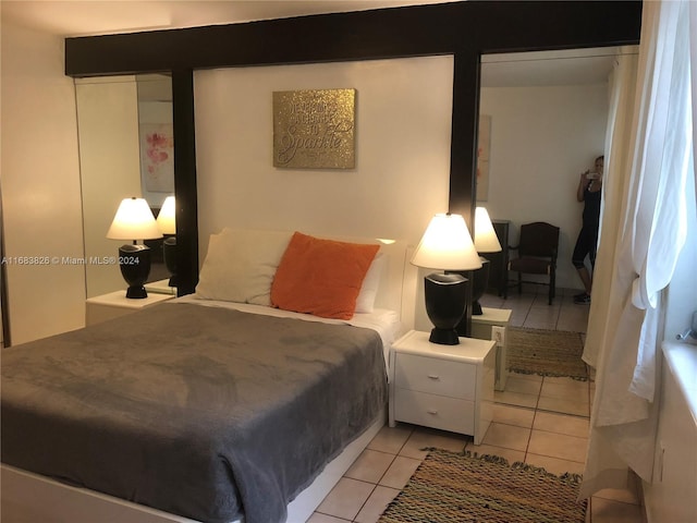 bedroom featuring light tile patterned floors