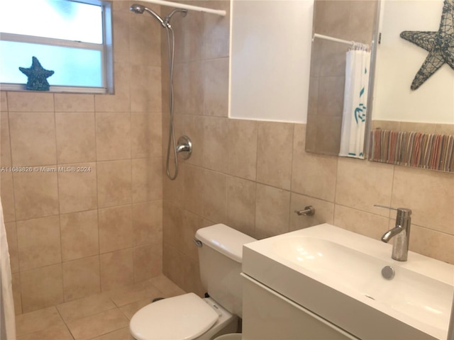 bathroom featuring tile walls, vanity, a shower with curtain, and toilet