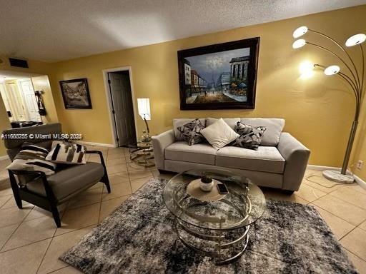 living room featuring light tile patterned floors