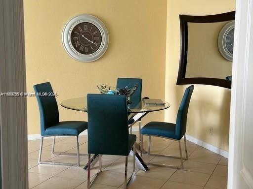 tiled dining area with baseboards