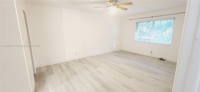 spare room featuring light hardwood / wood-style flooring and ceiling fan