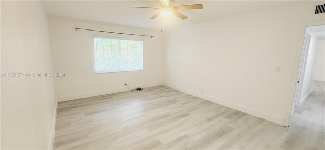 spare room with ceiling fan and light hardwood / wood-style flooring