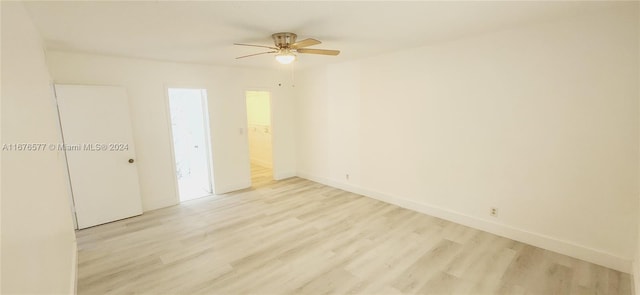 spare room featuring ceiling fan and light hardwood / wood-style flooring