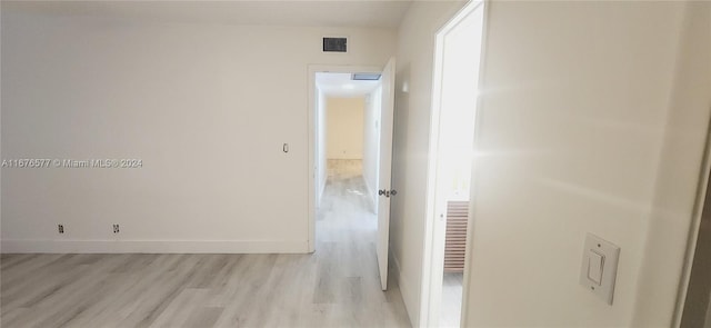 corridor featuring light hardwood / wood-style floors