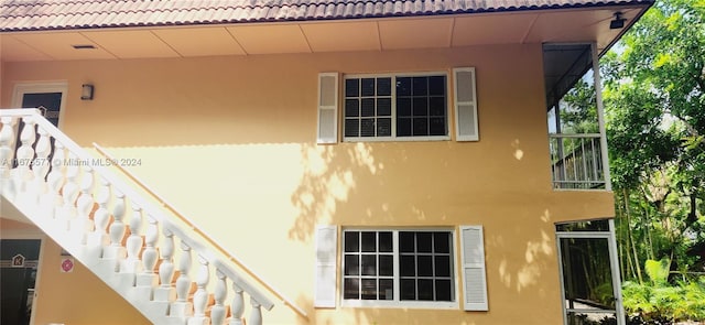 view of home's exterior with a balcony