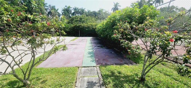 surrounding community featuring a patio and a lawn